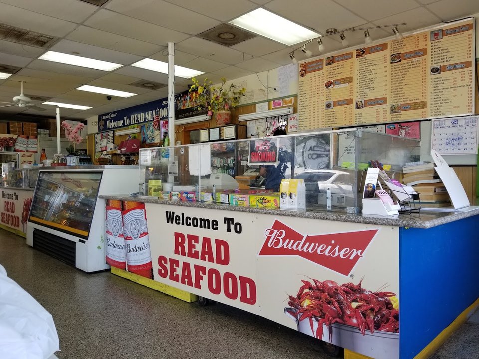 Simple restaurant seating near the order counter.